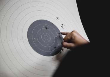 Pistol bullseye target shooting training in an indoor shooting club