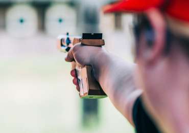 Woman on sport shooting training shooting target